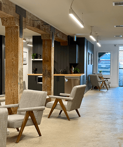 Original 1930 timber beams and posts visible in the restored interior